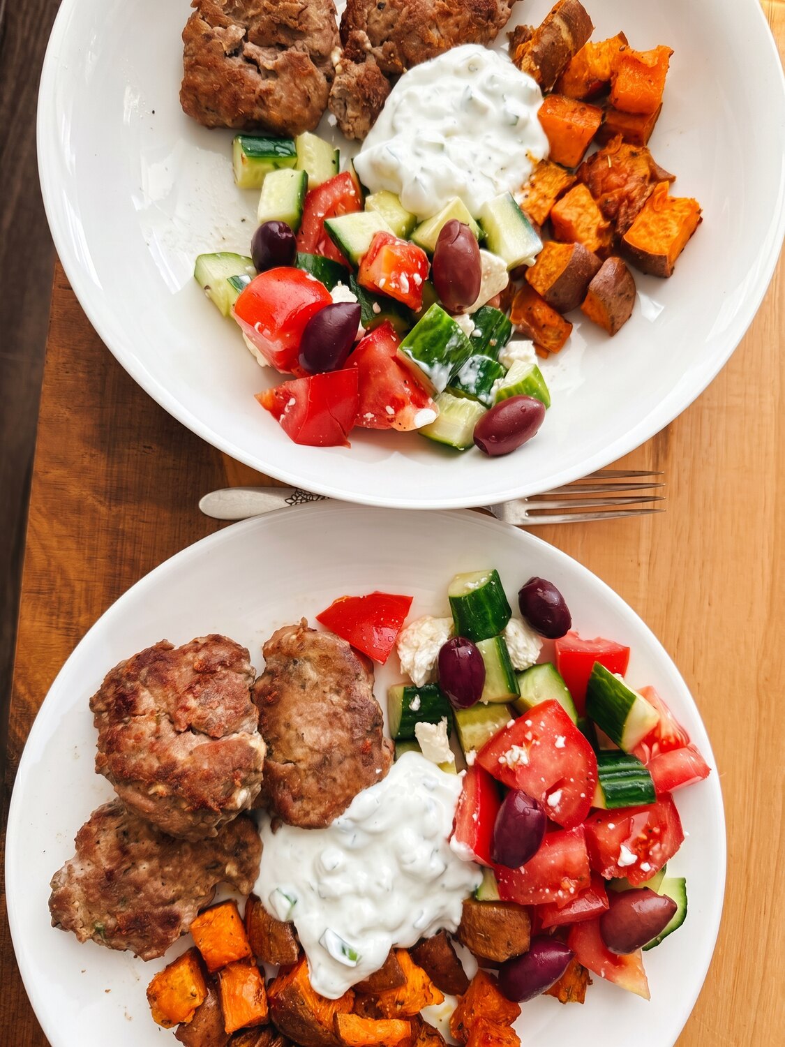 A colourful plate of meatballs, yogurt and roasted vegetables
